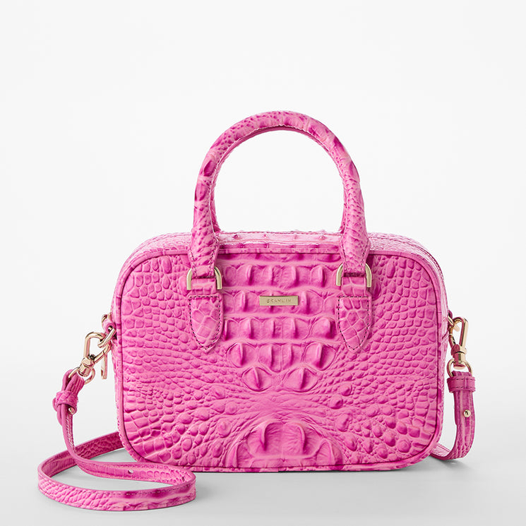 Pink textured Mara satchel handbag with a shoulder strap on a light gray background front view