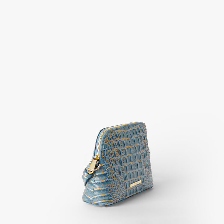 A small blue crocodile-embossed leather pouch with gold-tone hardware, photographed on a clean white background.