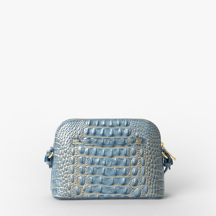 A light blue crocodile-embossed leather handbag with gold-tone hardware, shown against a plain white background.