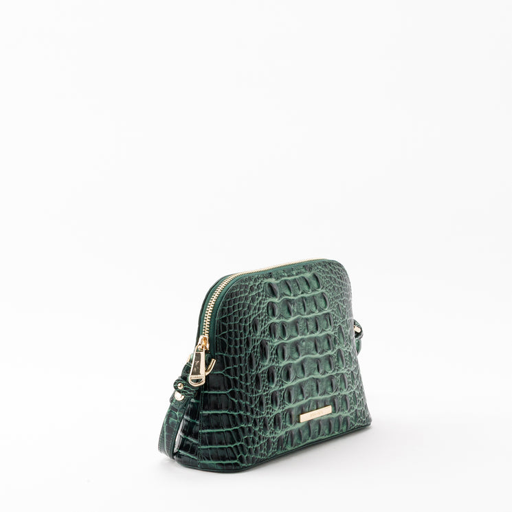 Brahmin Amal dome crossbody bag in forest green with a textured croc-embossed pattern, gold hardware, and zipper closure.