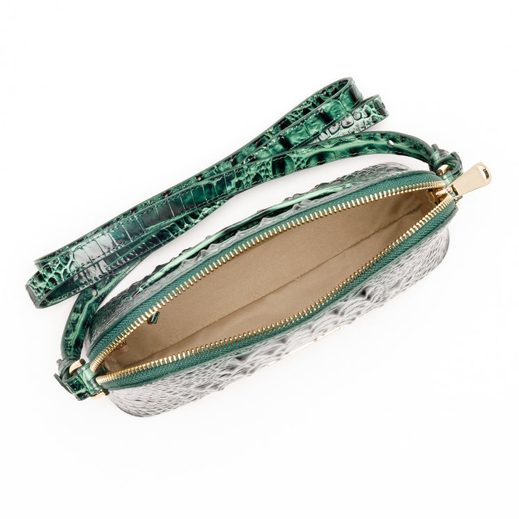Open emerald green Amal crossbody bag by BRAHMIN featuring an embossed texture, gold zipper, and shoulder strap.