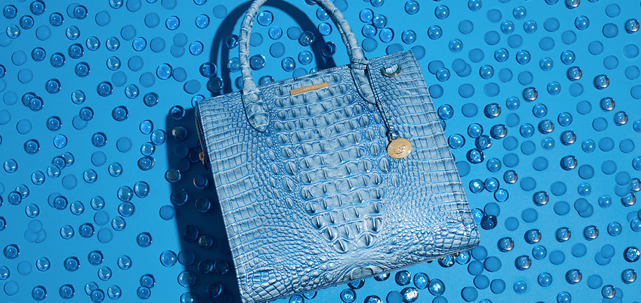 Aura Blue Caroline on blue background with various blue stones