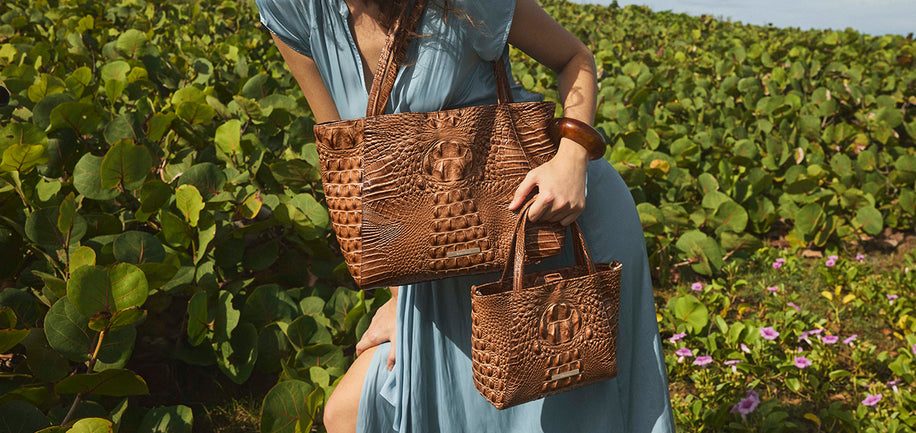 Cinnamon Alden Road Mona and Small Mona on model wearing a blue dress in a field