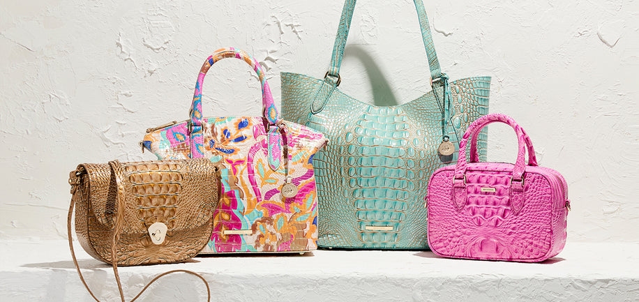 Collection of colorful handbags on a light background