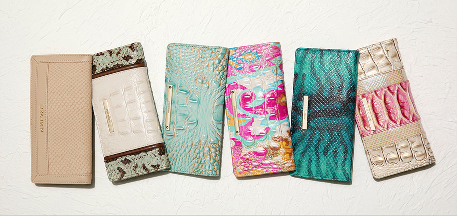 Collection of patterned ady wallets on a white background
