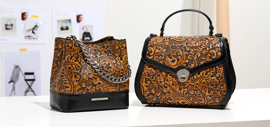 Two handbags displayed side by side on a white surface: a tall bucket bag with a brown and black floral embossed pattern and black base, and a structured flap handbag with the same pattern, black trim, top handle, and silver turn-lock closure.