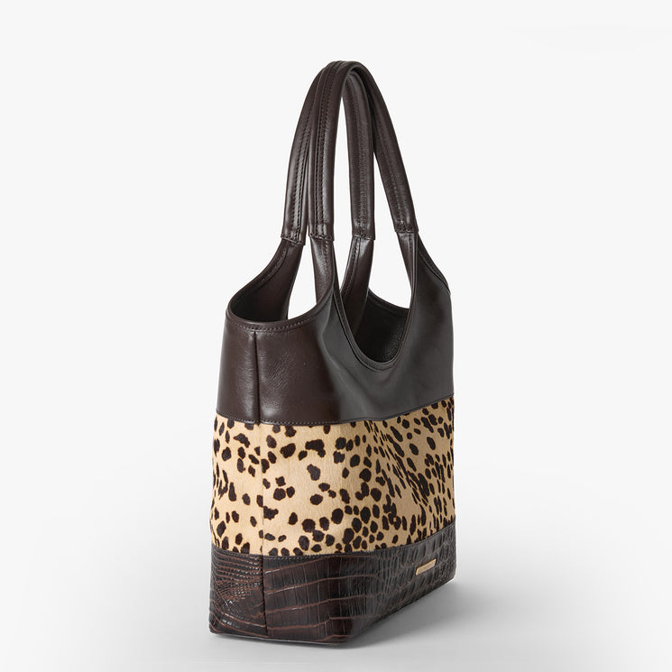 Brown Melora tote bag with leopard print panel on a white background. Side view.