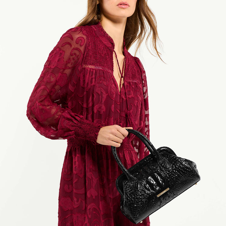 Model Holding Mika Black Melbourne In Hand