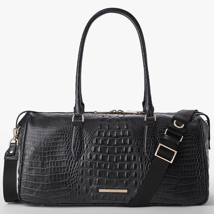 Brahmin black handbag with embossed texture, two top handles, gold-tone hardware, and a detachable adjustable shoulder strap. Rectangular silhouette with zippered top closure shown from a front angle.