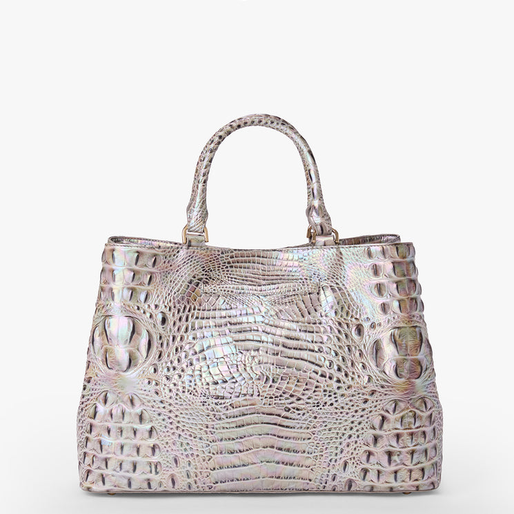 Brahmin iridescent handbag with embossed textured pattern, structured rectangular silhouette, double top handles, shiny finish, and silver-tone hardware on a plain white background. Front and side view.