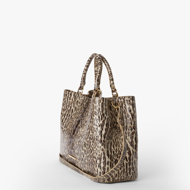 Leopard print tote bag on a white background. Denise side view with strap.