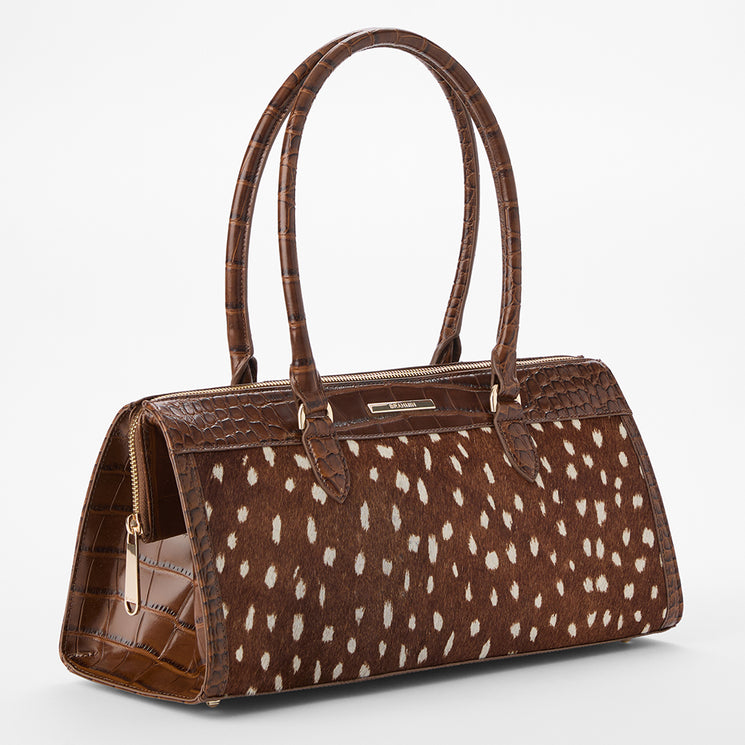 Brahmin structured brown handbag with embossed textured panels, animal-inspired print accents, two long shoulder straps, gold-tone zipper hardware, and a sleek silhouette shown against a plain white background.