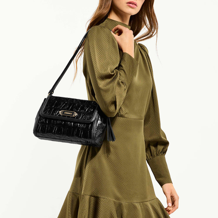 Model Wearing Black Castle View Jenah on Shoulder