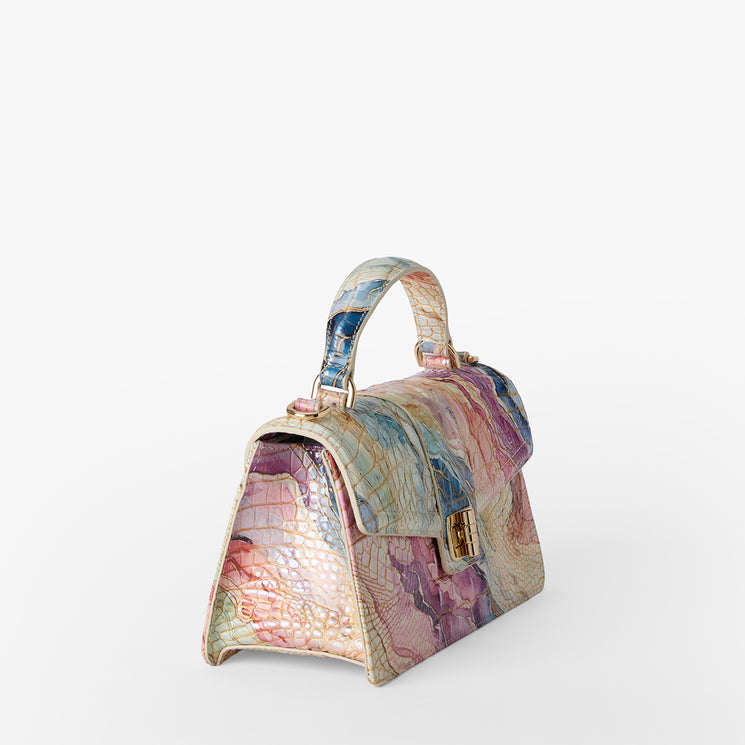 Multicolored handbag with a pattern on a white background. Side view.