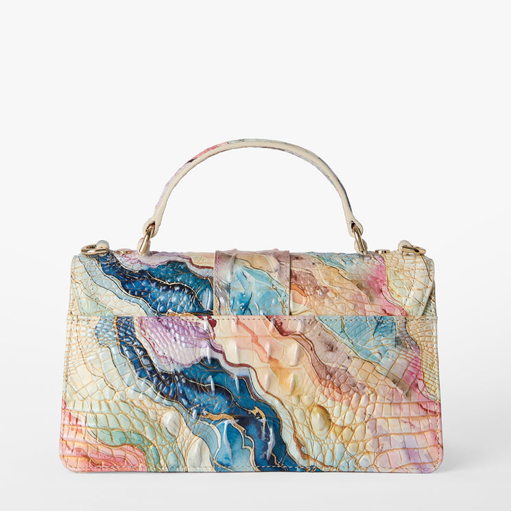 Multicolored handbag with a textured pattern on a white background. Back view.