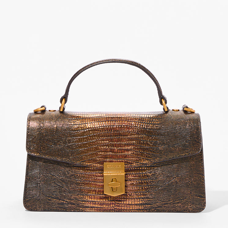 A structured top-handle handbag with a metallic bronze-brown textured leather exterior, gold-tone hardware, and a central clasp, shown on a clean white background.