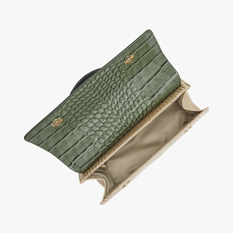 An olive green crocodile-embossed clutch bag with gold-tone hardware and a beige interior, shown open against a plain white background.