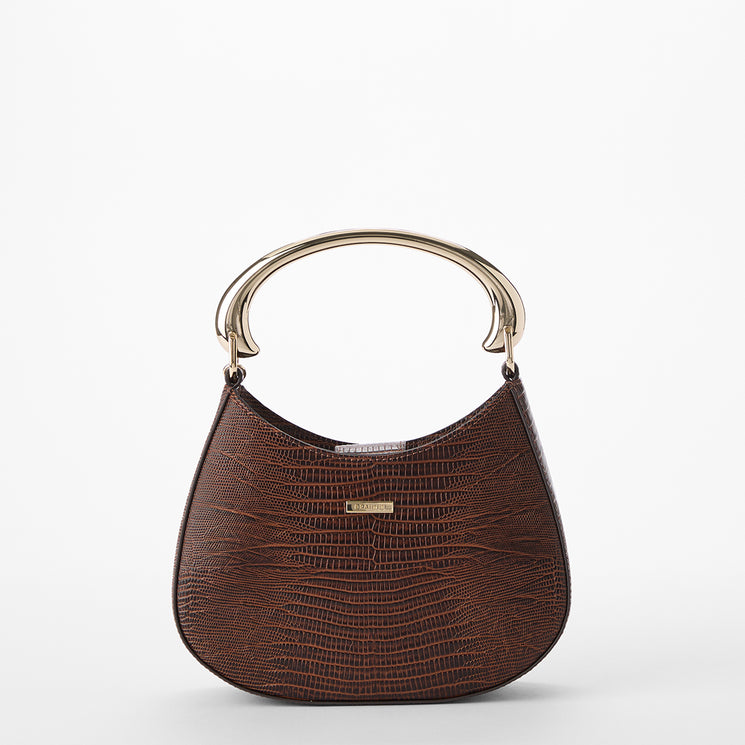 Patterned handbag with a gold handle on a white background. Brielle back view.