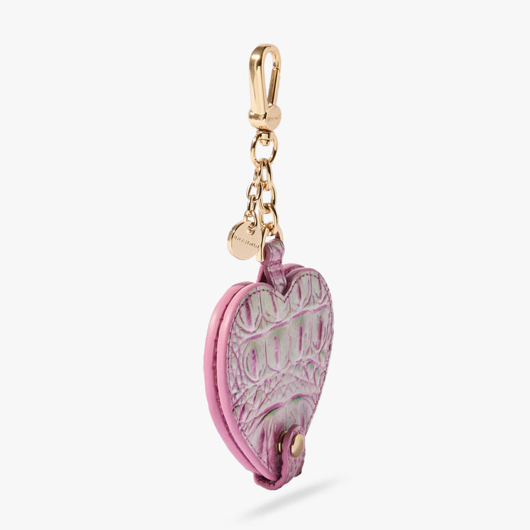 Brahmin pink heart-shaped keychain with embossed textured pattern, gold-tone chain and clasp, and a small round gold charm attached. Shown on a plain white background.