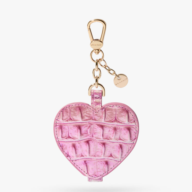 Brahmin heart-shaped pink keychain with embossed texture, featuring a gold clasp and two gold-tone charms, displayed on a white background.