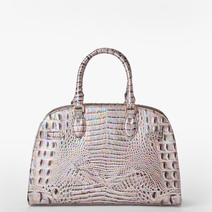 Brahmin iridescent dome satchel with embossed texture, double handles, and subtle pastel hues. Handbag shown on a plain white background, highlighting structured silhouette and croc-inspired pattern.