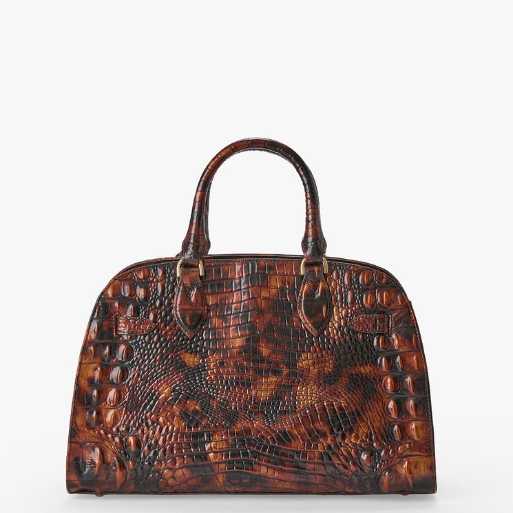 A brown crocodile-embossed leather handbag with dual top handles and gold-tone hardware, photographed against a clean white background.