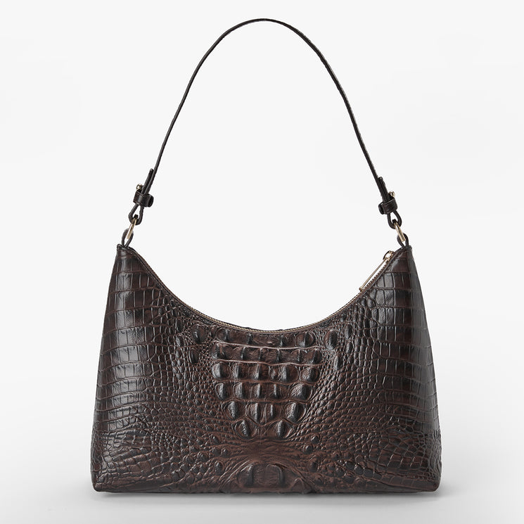 Brahmin handbag in dark brown embossed leather with a curved silhouette, short top handle, gold-tone hardware, and textured pattern, shown against plain white background. Structured style suitable for hand or arm carry.