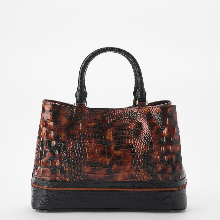 A structured handbag with a brown and black crocodile-embossed pattern, featuring black leather top handles and a solid black base with a thin brown stripe.