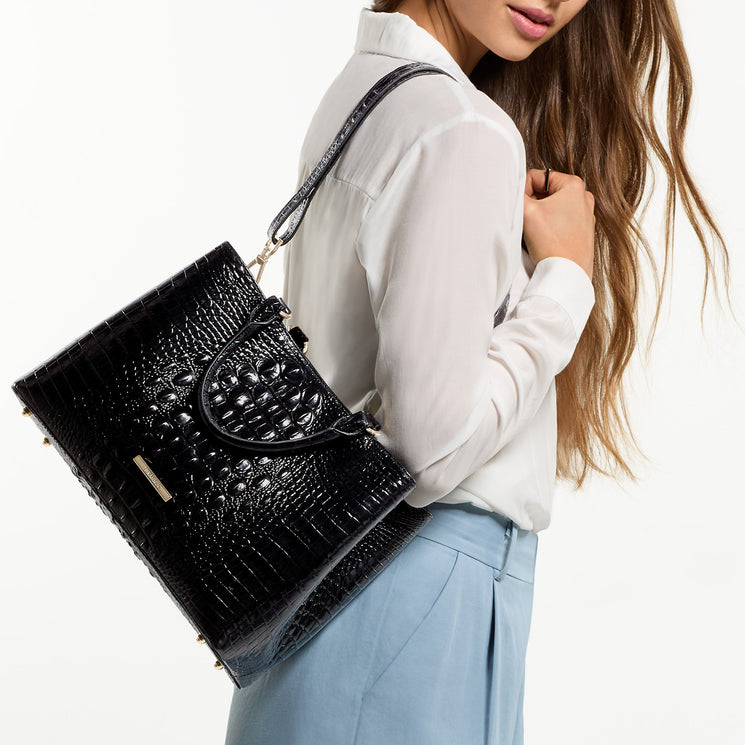 Woman wearing Black Melbourne Small Denise on shoulder against a white background