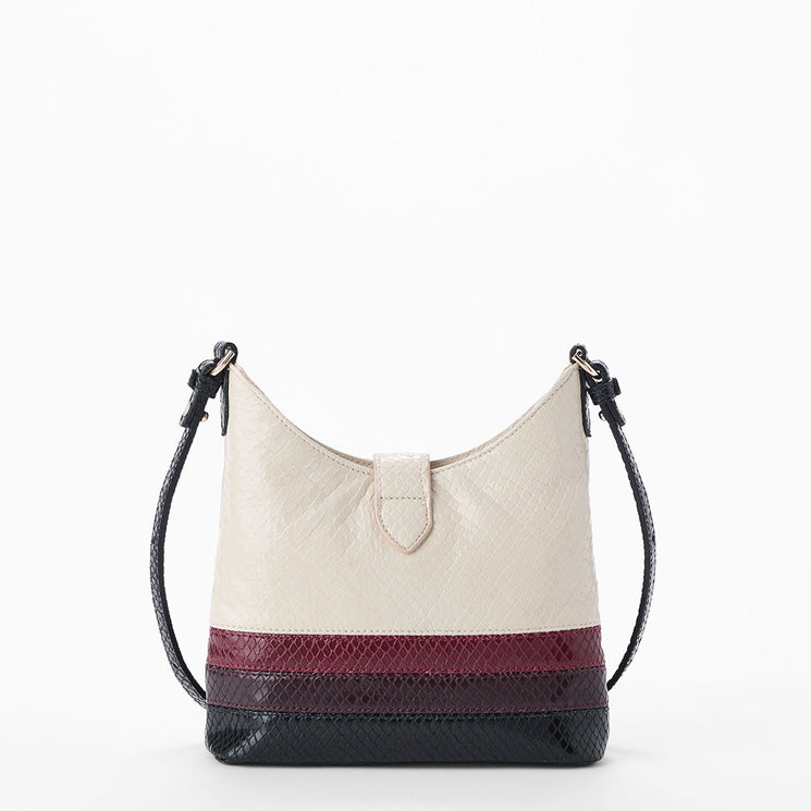 Cream Small Gwynne crossbody bag with black and red accents on a white background. Back view.