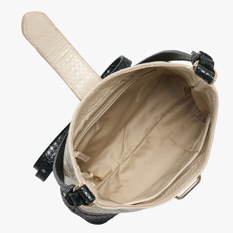 Cream Small Gwynne crossbody bag with black and red accents on a white background. Open top view.