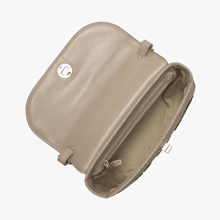 Beige handbag with butterfly and fern designs on a white background. Portia open top view.