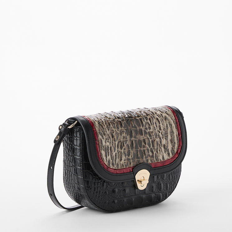 Brahmin handbag with leopard print and black and red leather accents on a white background. Portia side view.