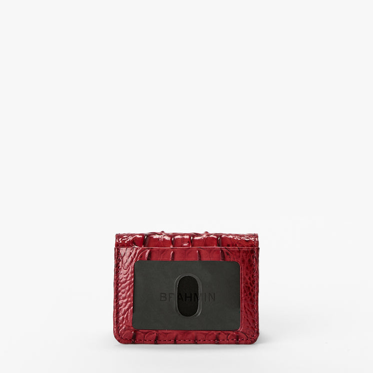 Volcanic Red Melbourne croc textured wallet on a light gray background. Clementine back view.