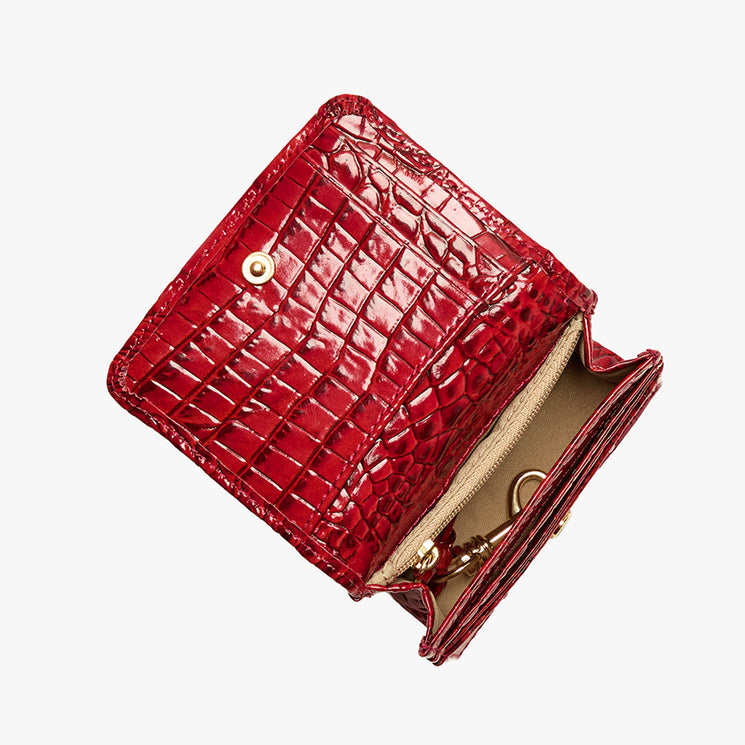 Volcanic Red Melbourne croc textured wallet on a light gray background. Clementine open top view.