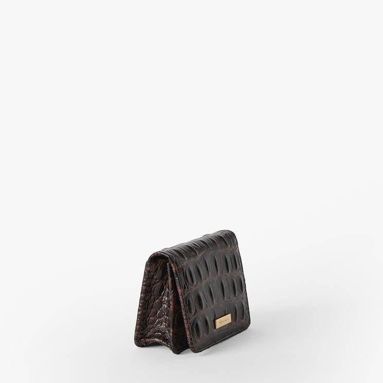 Brown Clementine wallet on a white background. Side view.