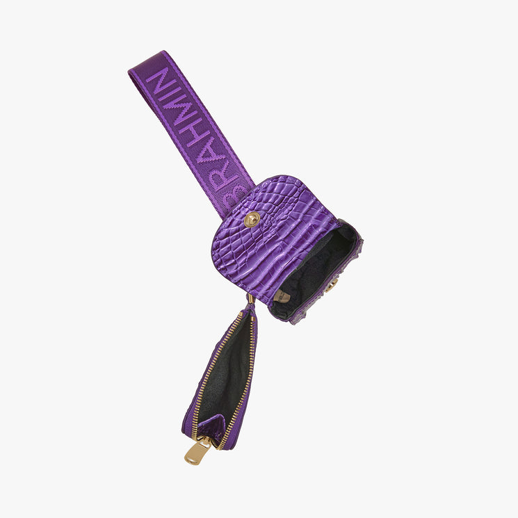 Brahmin purple textured wristlet purse with gold zipper, shown open to reveal a black-lined interior. Features embossed surface and logo wrist strap. Compact silhouette designed for handheld or wrist carry.