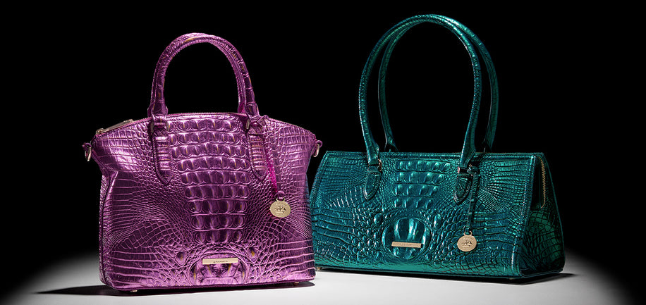 Opera Melbourne Purple and Mystic Green Melbourne teal handbags with crocodile texture on a black background