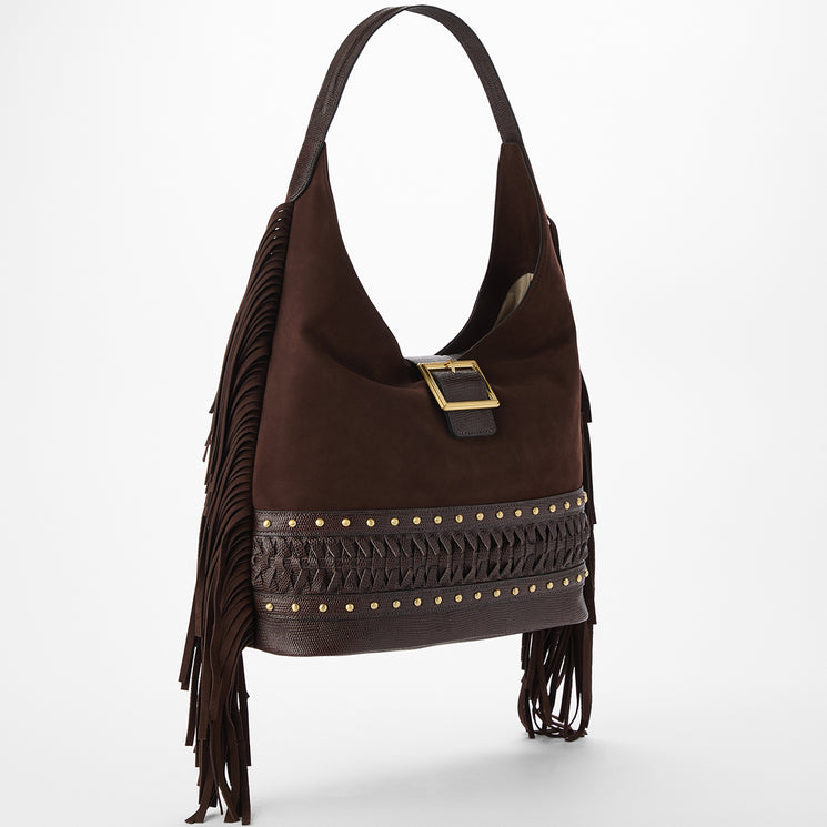 Brown suede handbag with fringes and gold accents on a white background. Gwynne side view.