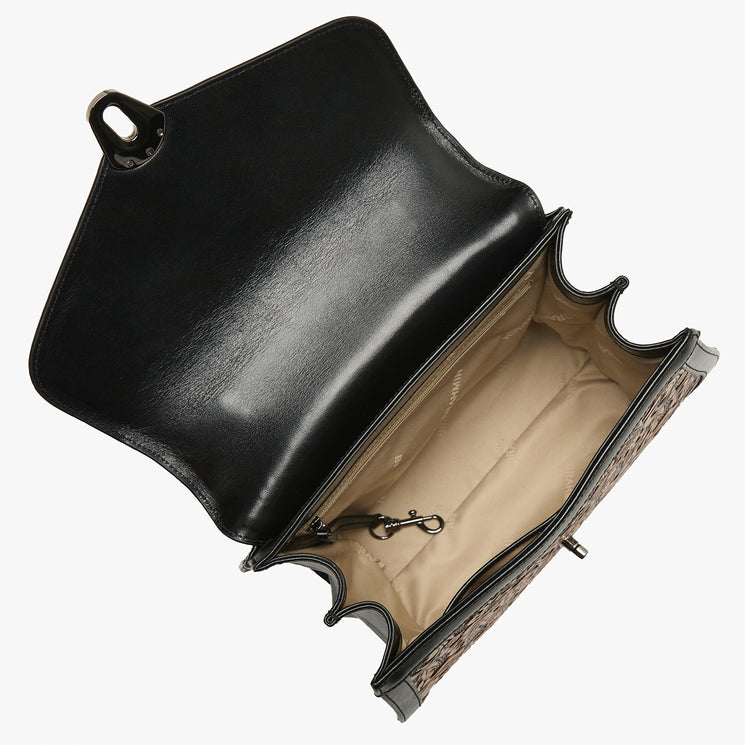 Brown leather handbag with intricate patterns on a white background. Annalise open top view.