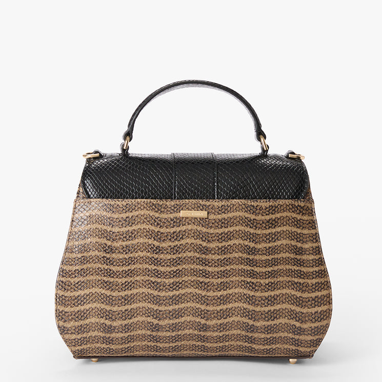 Annalise handbag with black and brown pattern on a white background. Back view.