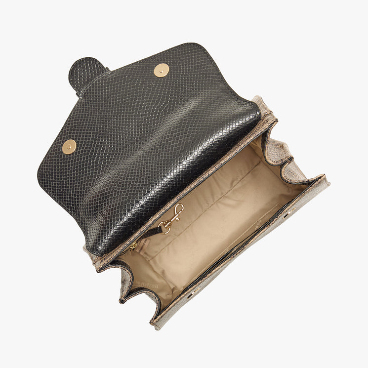 Annalise handbag with black and brown pattern on a white background. Open top view.