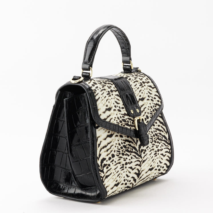 Brahmin Annalise top-handle satchel with a turn-lock closure. Features black glossy embossed sides and handle, a tan and black animal-inspired print front panel, and gold-tone hardware.