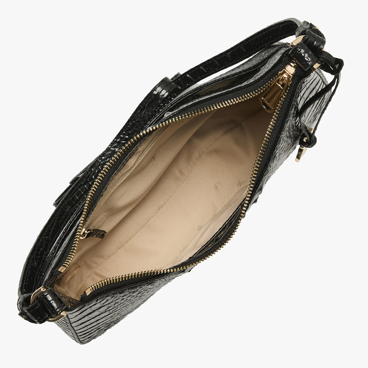 Black crocodile-embossed leather handbag shown open from a top-down angle, revealing a beige interior lining and gold-tone zipper hardware.