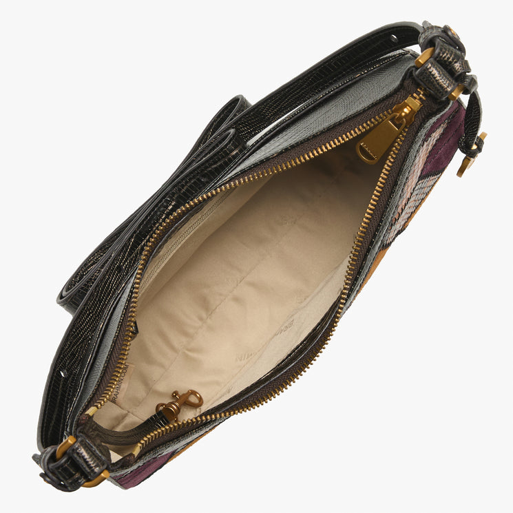 An open black leather shoulder bag with gold-tone hardware, showing a beige interior lining and a patterned exterior with purple and orange  tones, photographed on a light gray background.