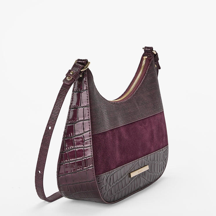 A hobo-style shoulder bag with a color-blocked design featuring glossy dark purple crocodile-embossed leather, a dark gray crocodile-embossed panel, and a deep purple suede center stripe. The bag has a matching dark purple shoulder strap and a gold-tone zipper.