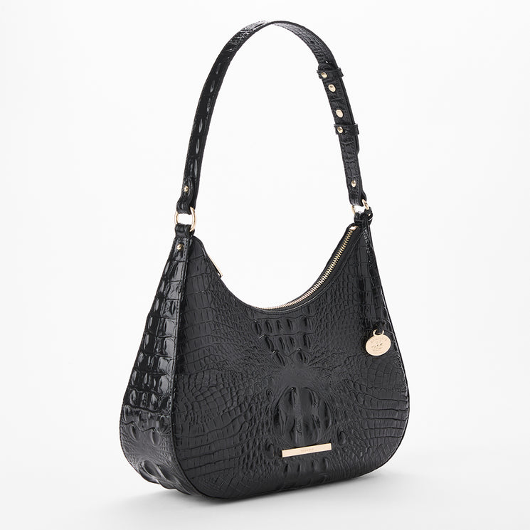 A black crocodile-embossed hobo shoulder bag with gold-tone hardware, shown on a clean white background. Side view.