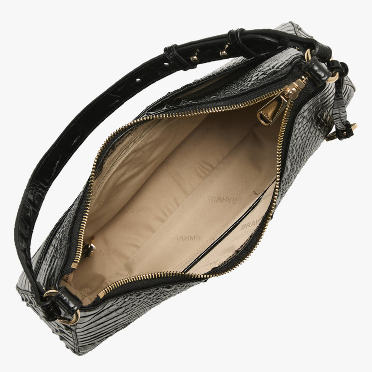 Black crocodile-embossed leather handbag shown open to display the beige interior lining and gold-tone hardware, set against a plain white background.