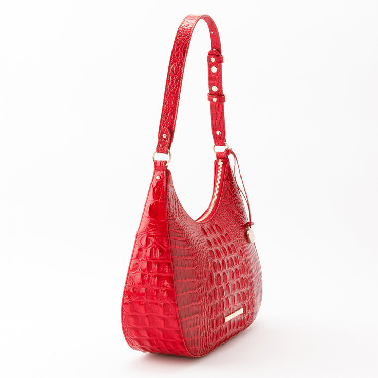 Brahmin Stephie hobo bag in glossy red with a crescent shape, croc-embossed texture, single adjustable shoulder strap, top zip closure, and gold-tone hardware.