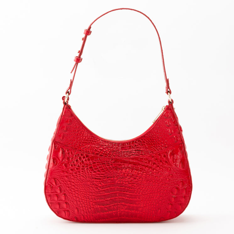 Brahmin Stephie shoulder bag in holiday red with a glossy, croc-embossed crescent silhouette, zipper closure, adjustable single shoulder strap, and gold-tone hardware.